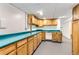 Basement features spacious counter space and built in cabinets for storage and organization at 8511 Essex Dr, Denver, CO 80229
