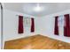 Bright bedroom with hardwood floors, natural light, and two windows at 8511 Essex Dr, Denver, CO 80229