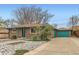 A full view of the exterior, including brick siding and rock landscaping at 8511 Essex Dr, Denver, CO 80229