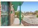 A partial view of the exterior of the home showcasing the walkway and rock landscaping at 8511 Essex Dr, Denver, CO 80229
