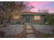 Charming brick home with a rock front yard and a welcoming, covered entryway at 8511 Essex Dr, Denver, CO 80229