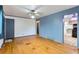 Spacious living room with hardwood floors and access to the kitchen at 8511 Essex Dr, Denver, CO 80229