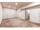 Spacious basement featuring neutral carpet and plenty of storage with multiple closets at 1530 S Quebec Way # 29, Denver, CO 80231