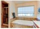 Bathroom with tub and shower combination, providing options for relaxation and convenience at 1530 S Quebec Way # 29, Denver, CO 80231
