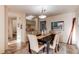 Elegant dining room features a large table, plush chairs, and access to a bar area at 1530 S Quebec Way # 29, Denver, CO 80231