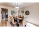 Inviting dining room features neutral decor, a statement art piece and seating for six at 1530 S Quebec Way # 29, Denver, CO 80231