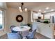 Charming breakfast nook features an elegant chandelier, comfortable seating, and easy kitchen access at 1530 S Quebec Way # 29, Denver, CO 80231