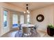 Cozy breakfast nook with bright lighting, stylish seating, and convenient outdoor access at 1530 S Quebec Way # 29, Denver, CO 80231