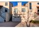 Two-story home featuring a garage, red tile roof, stucco siding and stairs to the main entrance at 1530 S Quebec Way # 29, Denver, CO 80231