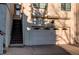 Two-story home featuring a garage, red tile roof, stucco siding and stairs to the main entrance at 1530 S Quebec Way # 29, Denver, CO 80231