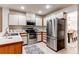 Well-lit kitchen with stainless steel appliances, plenty of cabinet space, and modern finishes at 1530 S Quebec Way # 29, Denver, CO 80231