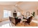 Spacious living room featuring neutral tones, vaulted ceilings, and comfortable seating arrangements at 1530 S Quebec Way # 29, Denver, CO 80231