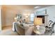 Comfortable living room with plush sofa, decorative fireplace, and abundant natural light at 1530 S Quebec Way # 29, Denver, CO 80231