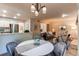 Inviting living room with open layout, neutral tones, and stylish lighting fixture at 1530 S Quebec Way # 29, Denver, CO 80231