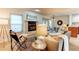 Bright and airy living room with fireplace, comfortable seating and dining area visible at 1530 S Quebec Way # 29, Denver, CO 80231