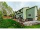 Expansive backyard featuring a patio, hot tub, manicured lawn, and lush landscaping at 919 Taylor Ln, Erie, CO 80516