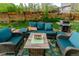 Backyard patio with comfortable seating, a grill, and a lush green lawn perfect for outdoor relaxation at 919 Taylor Ln, Erie, CO 80516