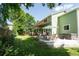 Spacious backyard featuring a patio, mature trees, and lush lawn, creating a relaxing outdoor oasis for entertainment at 919 Taylor Ln, Erie, CO 80516