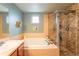 Bathroom featuring a soaking tub, tiled shower, and vanity with a sink at 919 Taylor Ln, Erie, CO 80516