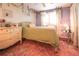 Charming bedroom with a bed, dresser, decor, and natural light streaming through shuttered windows at 919 Taylor Ln, Erie, CO 80516