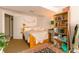Comfortable bedroom with a cozy bed, open doorway, and ample storage space at 919 Taylor Ln, Erie, CO 80516