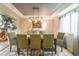 Well-lit dining room featuring modern decor, a large window, and an area rug at 919 Taylor Ln, Erie, CO 80516
