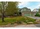 Charming two-story home with well-maintained lawn, stone accents, and an attached garage at 919 Taylor Ln, Erie, CO 80516