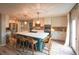 Well-lit kitchen with an island, modern appliances, ample counter space, and sliding door access at 919 Taylor Ln, Erie, CO 80516