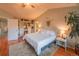 Cozy bedroom featuring vaulted ceilings, hardwood floors, and integrated shelving unit at 919 Taylor Ln, Erie, CO 80516