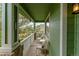 Inviting porch featuring white columns, comfortable seating, and scenic views at 919 Taylor Ln, Erie, CO 80516