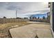 Backyard features large concrete patio and landscaping at 5423 Ben Park Cir, Parker, CO 80134