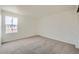 Empty bedroom features neutral walls, plush carpeting and a window at 5423 Ben Park Cir, Parker, CO 80134