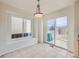 Bright dining area with natural light and a sliding glass door that leads to the backyard at 5423 Ben Park Cir, Parker, CO 80134