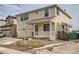 Charming two-story home featuring attached garage, welcoming front porch and a well-manicured lawn at 5423 Ben Park Cir, Parker, CO 80134