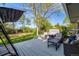 Outdoor living space featuring a spacious deck with seating, a hot tub, and a grassy yard at 2764 S Reading Ct, Denver, CO 80231