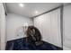 Inviting basement space featuring a modern massage chair, soft carpet and dimmable lights at 2764 S Reading Ct, Denver, CO 80231