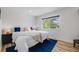 Bright bedroom with a comfortable bed, ample natural light, and minimalist decor for a relaxing atmosphere at 2764 S Reading Ct, Denver, CO 80231