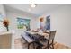 Dining room with elegant decor, a large window, and seating for six, ideal for Gathering gatherings at 2764 S Reading Ct, Denver, CO 80231