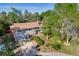 Charming home exterior with mature trees, a brick-lined driveway, and well-maintained landscaping at 2764 S Reading Ct, Denver, CO 80231