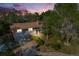 Charming home exterior with mature trees, a brick-lined driveway, and well-maintained landscaping at 2764 S Reading Ct, Denver, CO 80231