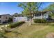 Charming two-story home with grey wood siding, brick accents, and a well-manicured front yard during daylight hours at 2764 S Reading Ct, Denver, CO 80231