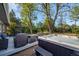 Inviting outdoor space featuring a luxurious hot tub and cozy seating area nestled amongst mature trees at 2764 S Reading Ct, Denver, CO 80231