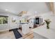 Bright, spacious kitchen with white cabinets, stainless steel appliances, and a large island perfect for cooking and entertaining at 2764 S Reading Ct, Denver, CO 80231