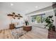 Cozy living room featuring bright natural light, stylish decor, and a comfortable seating arrangement at 2764 S Reading Ct, Denver, CO 80231