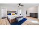 Bright main bedroom featuring a ceiling fan, ensuite bath and walk in closet at 2764 S Reading Ct, Denver, CO 80231