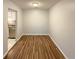 Simple dining area with laminate wood floors and access to kitchen at 7995 E Mississippi Ave # F11, Denver, CO 80247