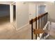 Hallway view with carpet flooring, mirrored closet and staircase at 7995 E Mississippi Ave # F11, Denver, CO 80247