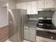 Kitchen features stainless steel appliances and updated cabinetry at 7995 E Mississippi Ave # F11, Denver, CO 80247