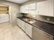 Clean kitchen with white cabinets, double sink, and stainless steel appliances at 7995 E Mississippi Ave # F11, Denver, CO 80247