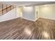 Bright living room with laminate wood floors and access to the kitchen and dining area at 7995 E Mississippi Ave # F11, Denver, CO 80247